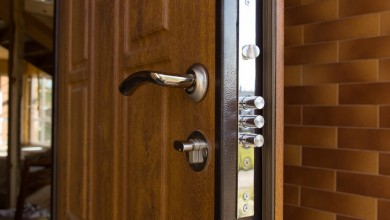 What criteria should you consider when choosing knobs and handles for your front door?